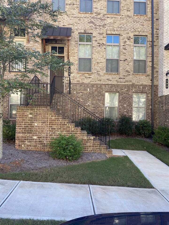 a view of a brick building with many windows
