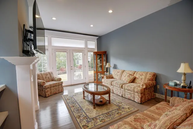 a living room with furniture fireplace and flat screen tv