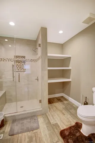 a bedroom with furniture and a window