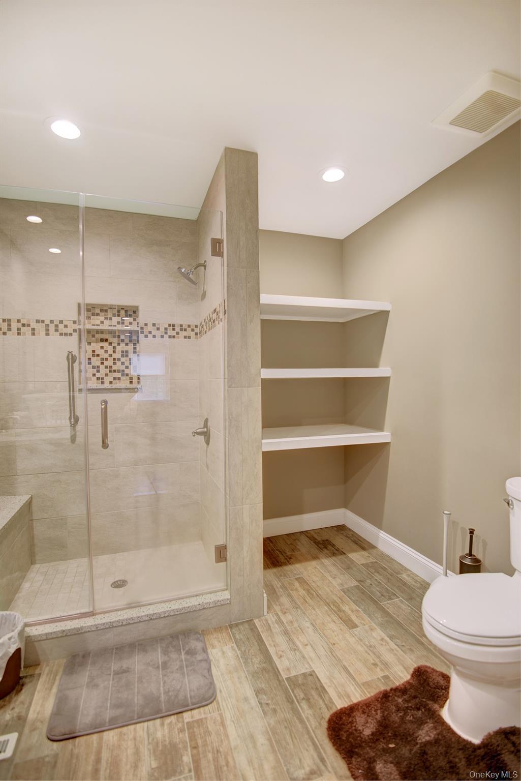 2 Spruce Place Bohemia, NY 11716 - Photo 16 of 34 a bathroom with a toilet and a shower