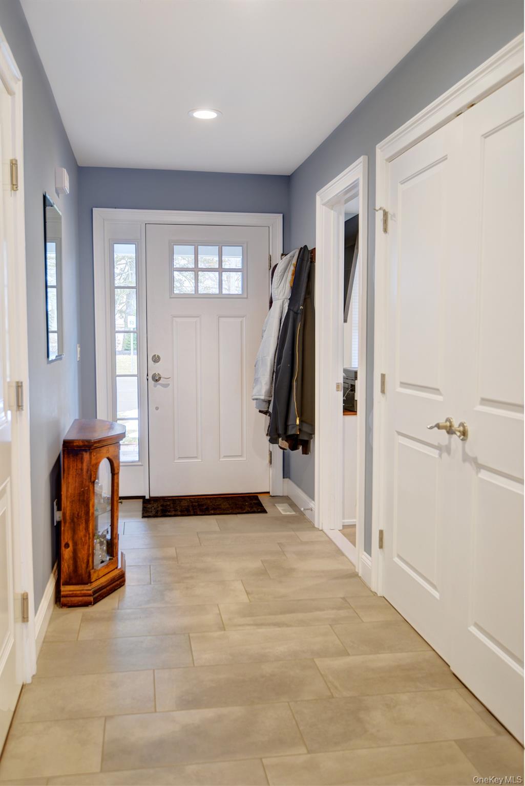 2 Spruce Place Bohemia, NY 11716 - Photo 2 of 34 a view of a livingroom with walk in closet and a window