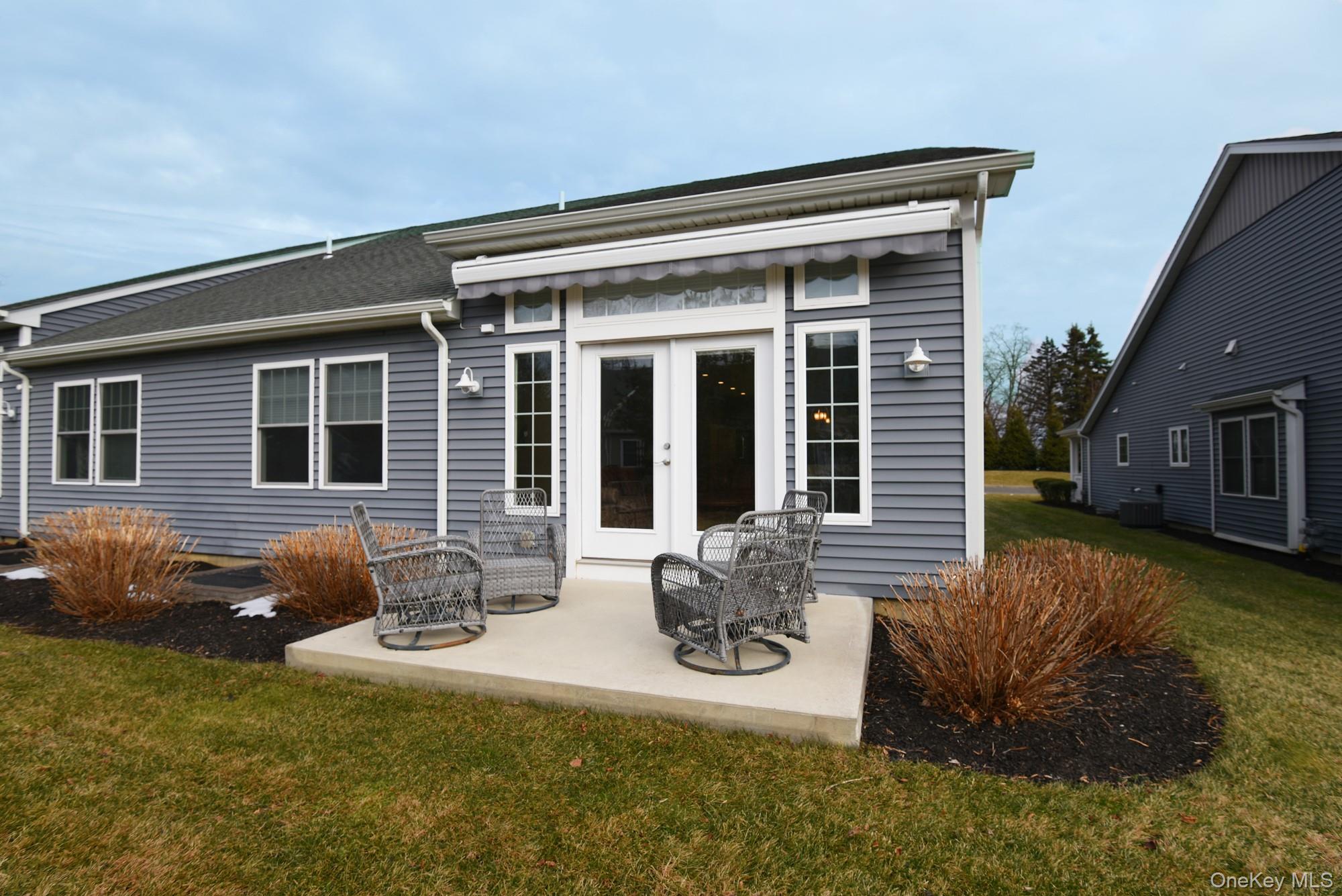 2 Spruce Place Bohemia, NY 11716 - Photo 27 of 34 a front view of house with yard outdoor seating and barbeque oven
