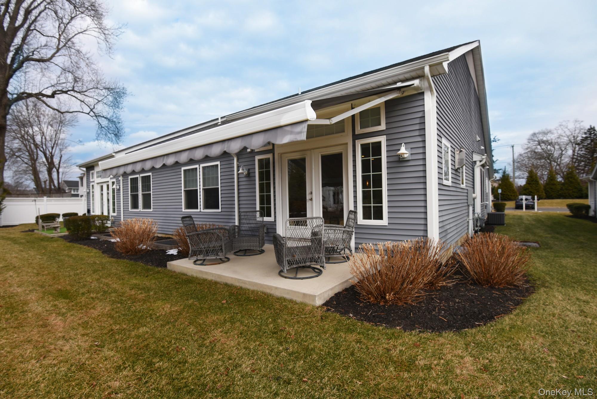2 Spruce Place Bohemia, NY 11716 - Photo 28 of 34 a front view of a house with garden