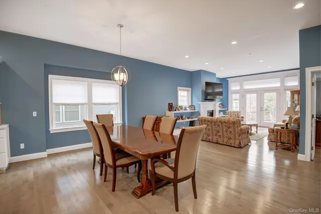 a kitchen with center island table and chairs