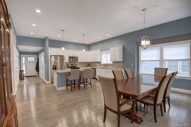 a view of a city street lined with buildings and trees