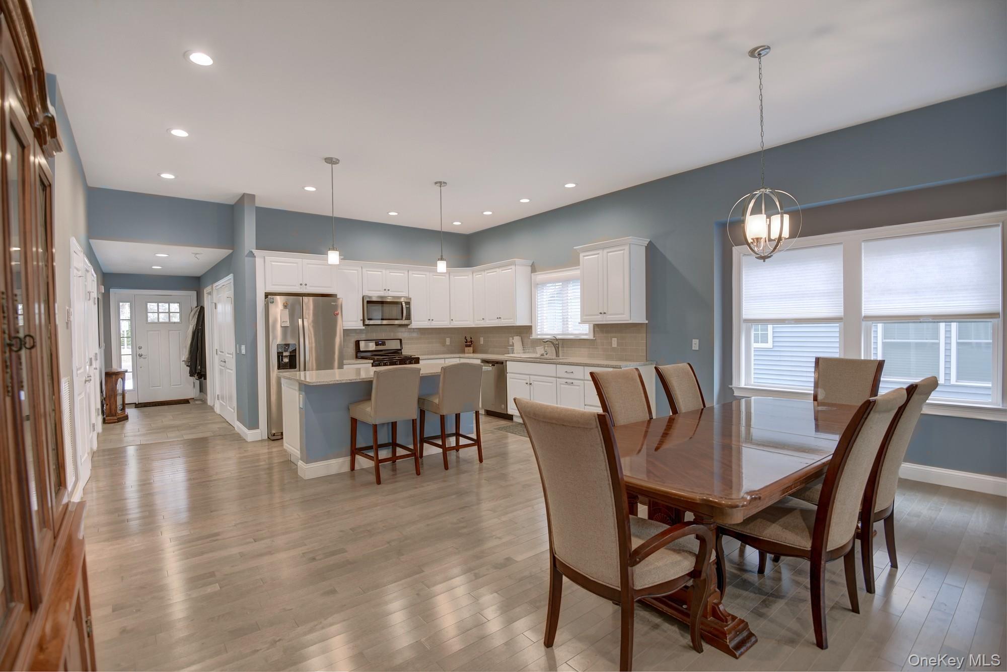 2 Spruce Place Bohemia, NY 11716 - Photo 32 of 34 a view of a dining area with furniture window and wooden floor