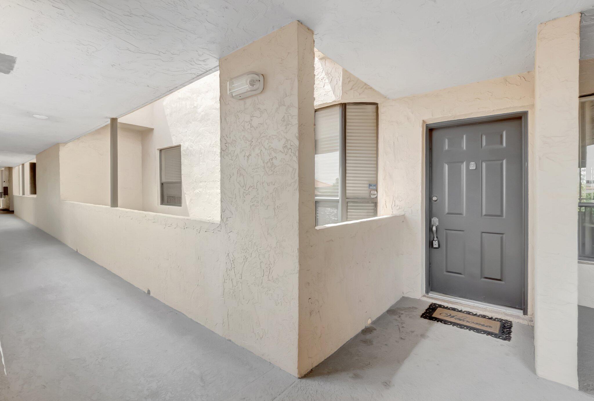 7472 La Paz Boulevard, Unit 302 Boca Raton, FL 33433 - Photo 3 of 36 Front door