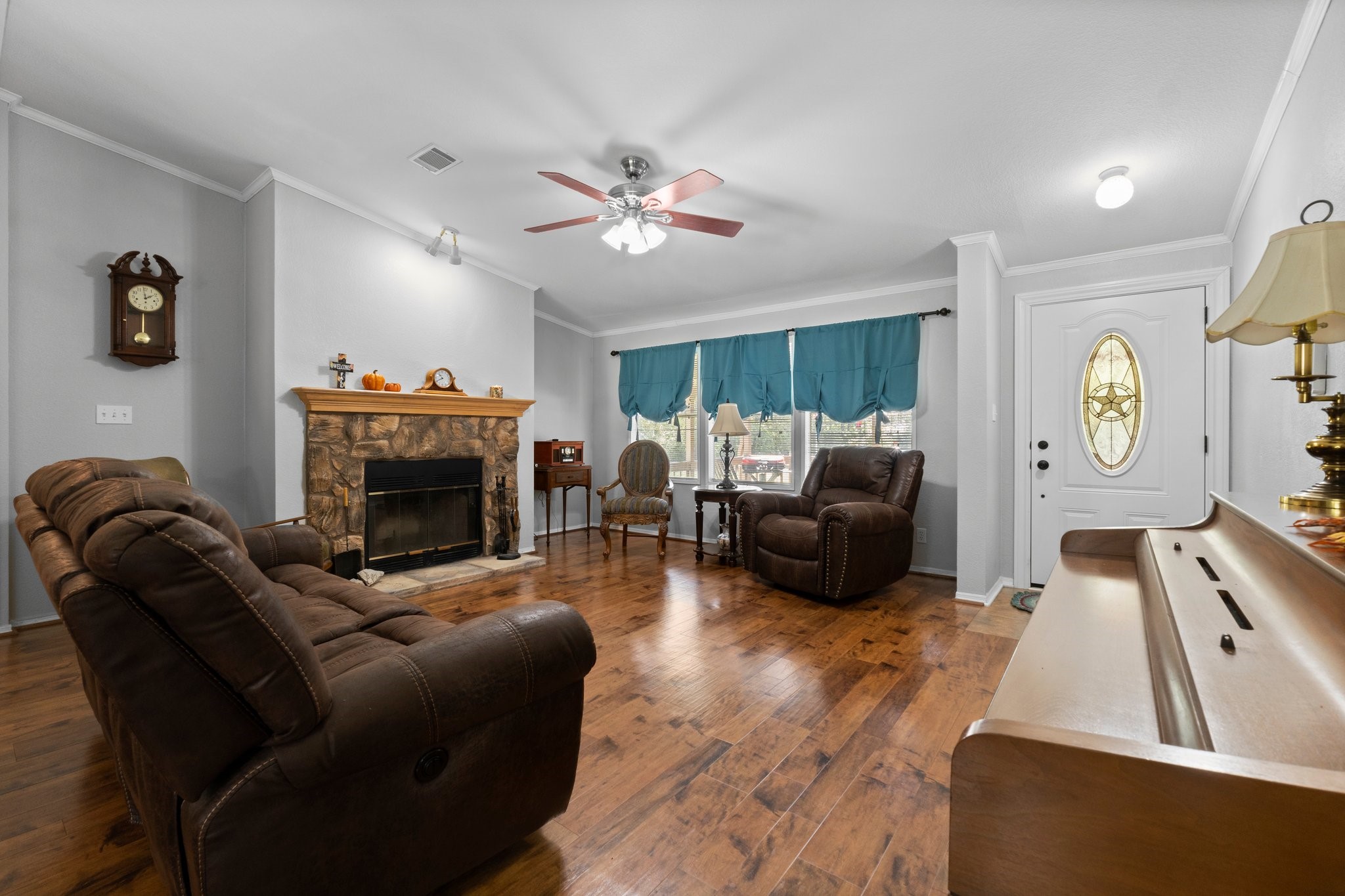 7105 Mt Zion Road New Waverly, TX 77358 - Photo 16 of 42 One of TWO living rooms. The recent paint is light and bright with beautiful wood tone floors.