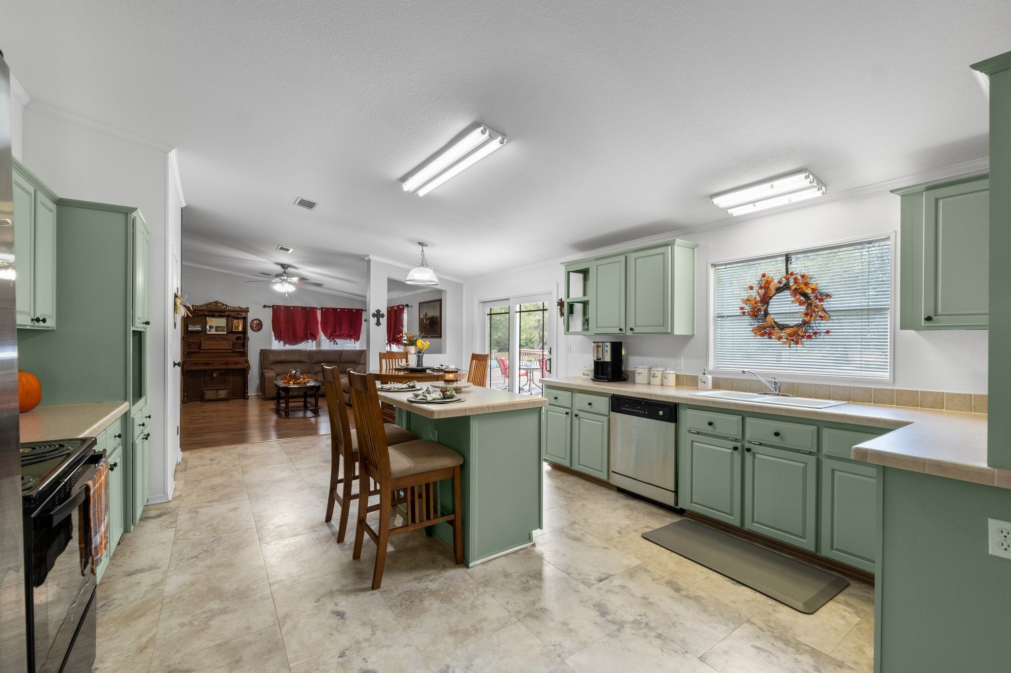 7105 Mt Zion Road New Waverly, TX 77358 - Photo 20 of 42 This kitchen is a place you want to be in! There's plenty of storage and so much natural light coming in from the oversized window and french doors.