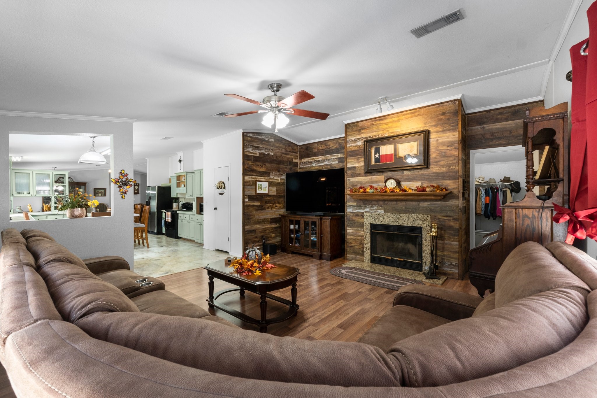 7105 Mt Zion Road New Waverly, TX 77358 - Photo 24 of 42 The gorgeous feature wall and wood burning fireplace with granite surround add the perfect touch to the space!