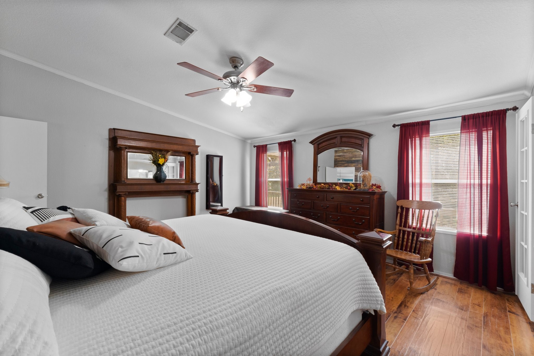 7105 Mt Zion Road New Waverly, TX 77358 - Photo 25 of 42 The beautiful floors carry into the spacious primary bedroom.