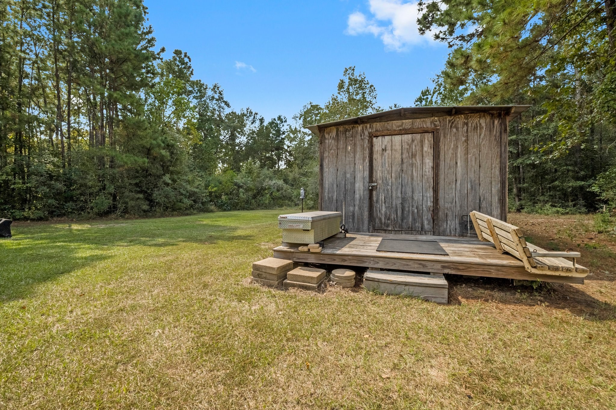 7105 Mt Zion Road New Waverly, TX 77358 - Photo 36 of 42 Shed provides additional storage for tools, outdoor equipment and more.