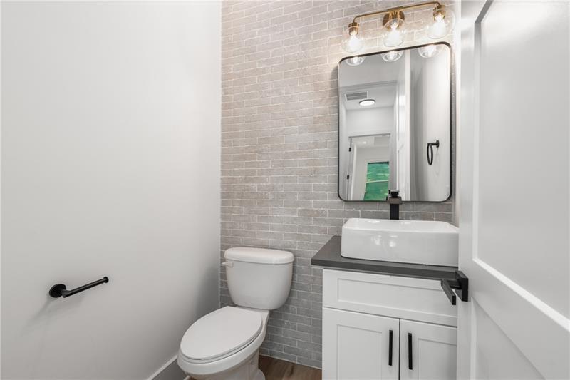 7252 Creekside Way Jefferson, GA 30549 - Photo 24 of 52 a bathroom with a toilet sink and mirror