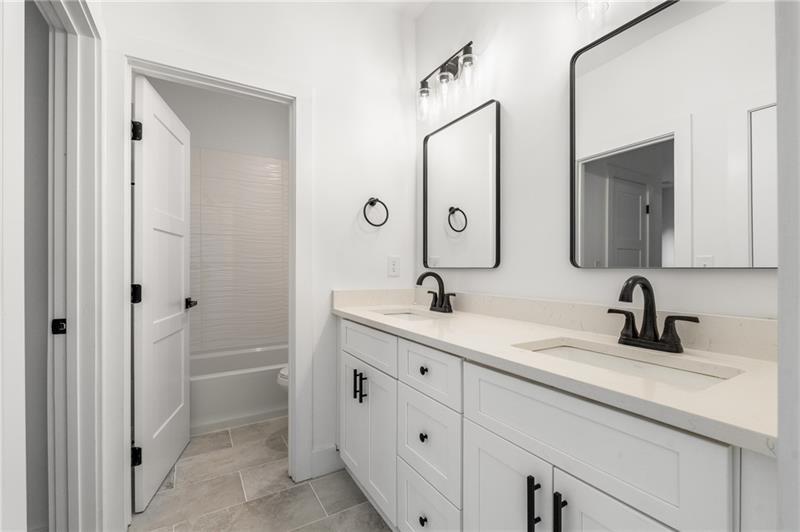 7252 Creekside Way Jefferson, GA 30549 - Photo 28 of 52 a bathroom with a double vanity sink mirror and