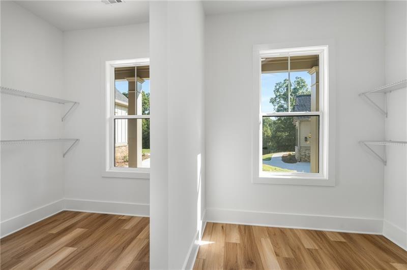 7252 Creekside Way Jefferson, GA 30549 - Photo 36 of 52 an empty room with windows and closet