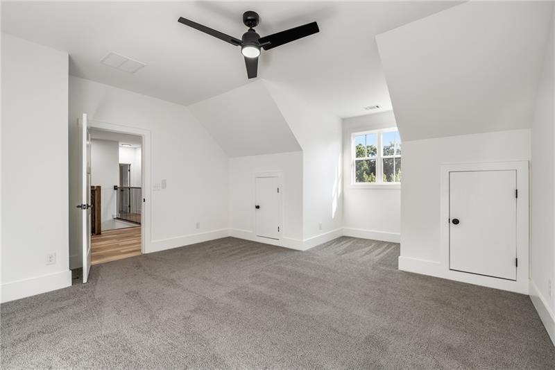 7252 Creekside Way Jefferson, GA 30549 - Photo 39 of 52 an empty room with windows and ceiling fan