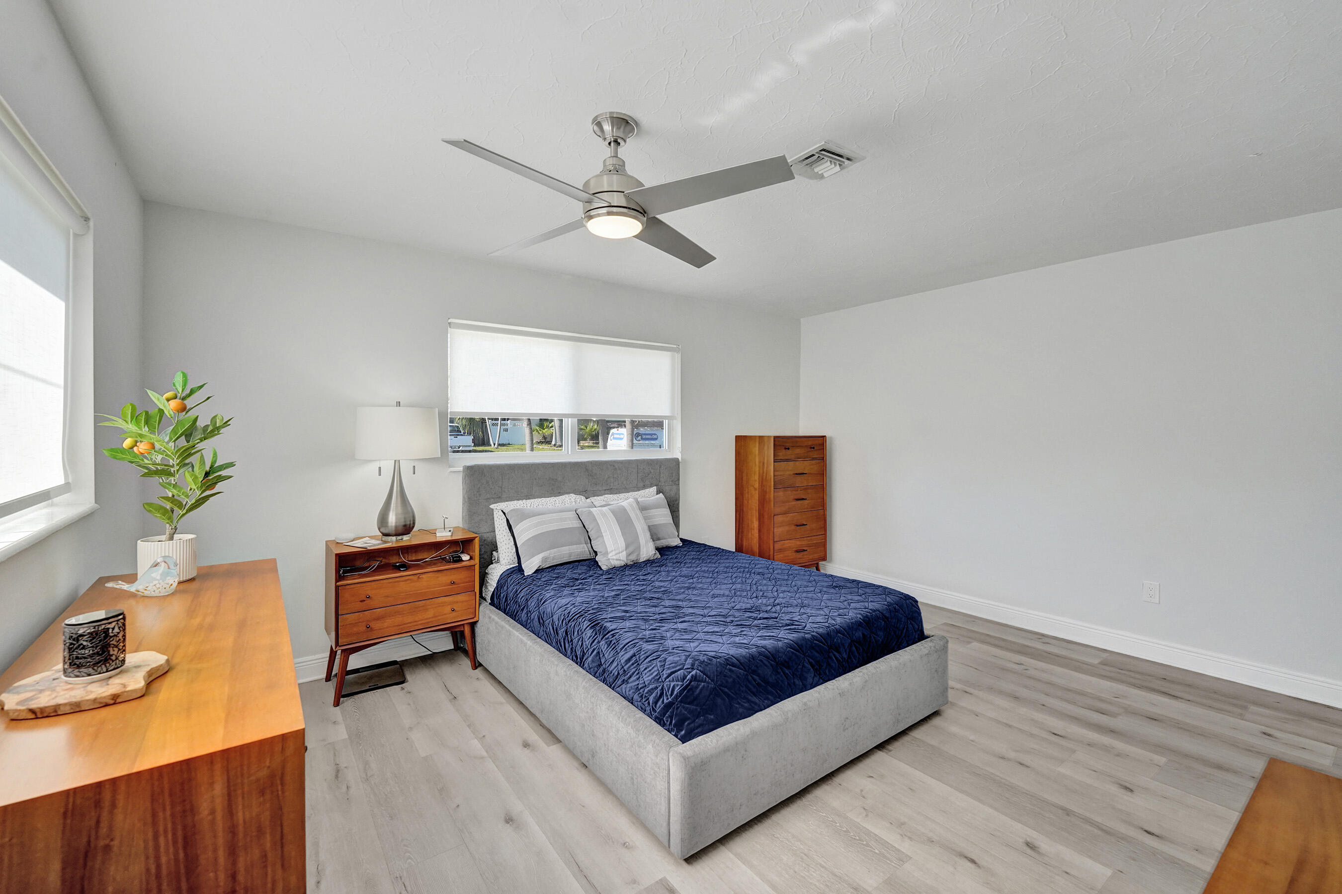 381 Southeast 3rd Street Pompano Beach, FL 33060 - Photo 20 of 41 a living room with a bed furniture and a window