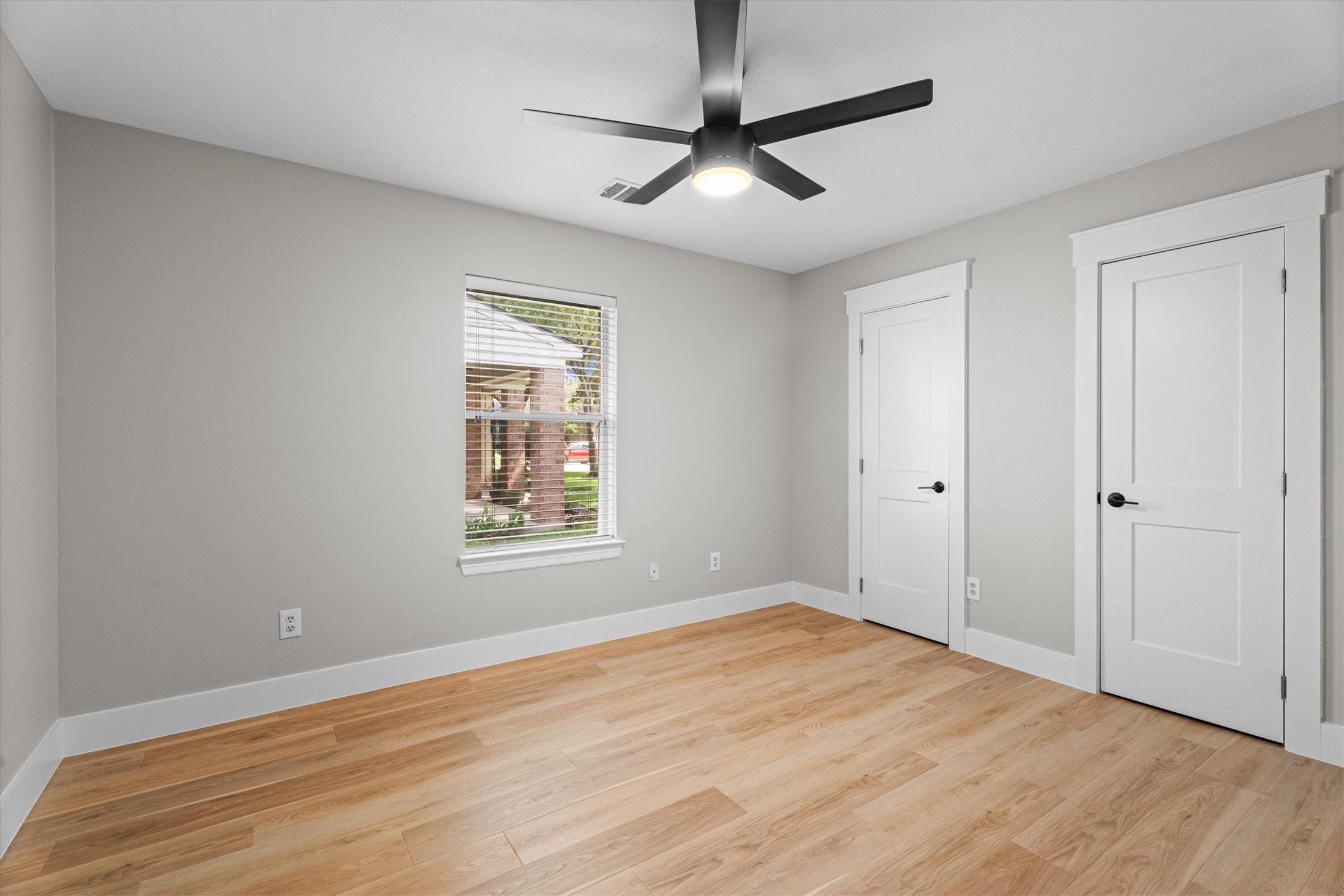 30111 Granum Drive Spring, TX 77386 - Photo 39 of 45 a view of an empty room with a window and wooden floor