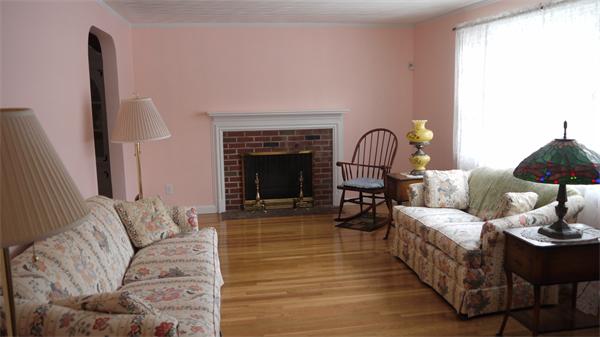 5 Rowell Road Danvers, MA 01923 - Photo 12 of 26 a living room with furniture and a fireplace