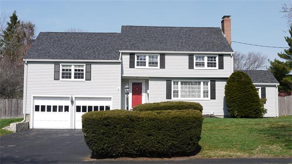 5 Rowell Road Danvers, MA 01923 - Photo 2 of 26 a front view of a house with a garden