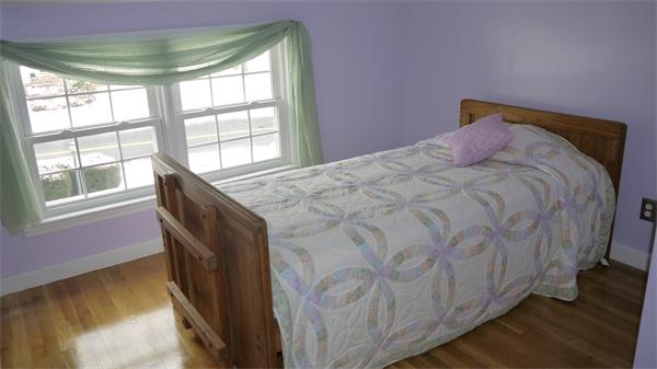 5 Rowell Road Danvers, MA 01923 - Photo 24 of 26 a bedroom with a bed and a large window