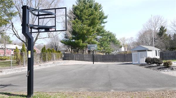5 Rowell Road Danvers, MA 01923 - Photo 9 of 26 a backyard of a house with table and chairs