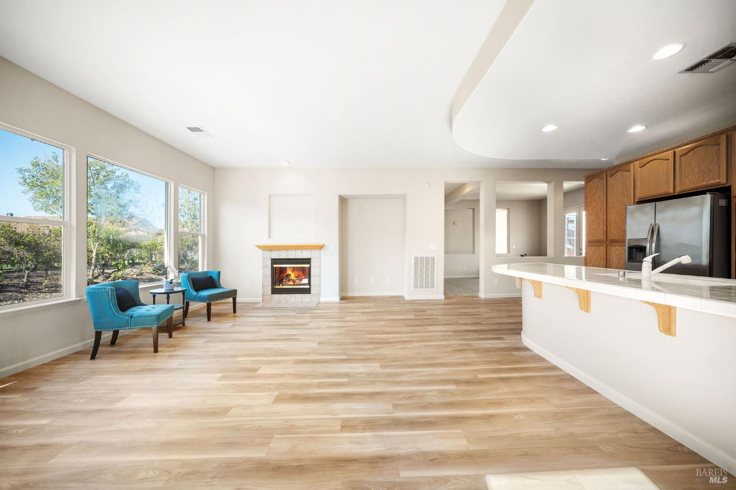 377 Shadow Creek Drive Rio Vista, CA 94571 - Photo 8 of 77 great room with fireplace and luxury vinyl plank flooring