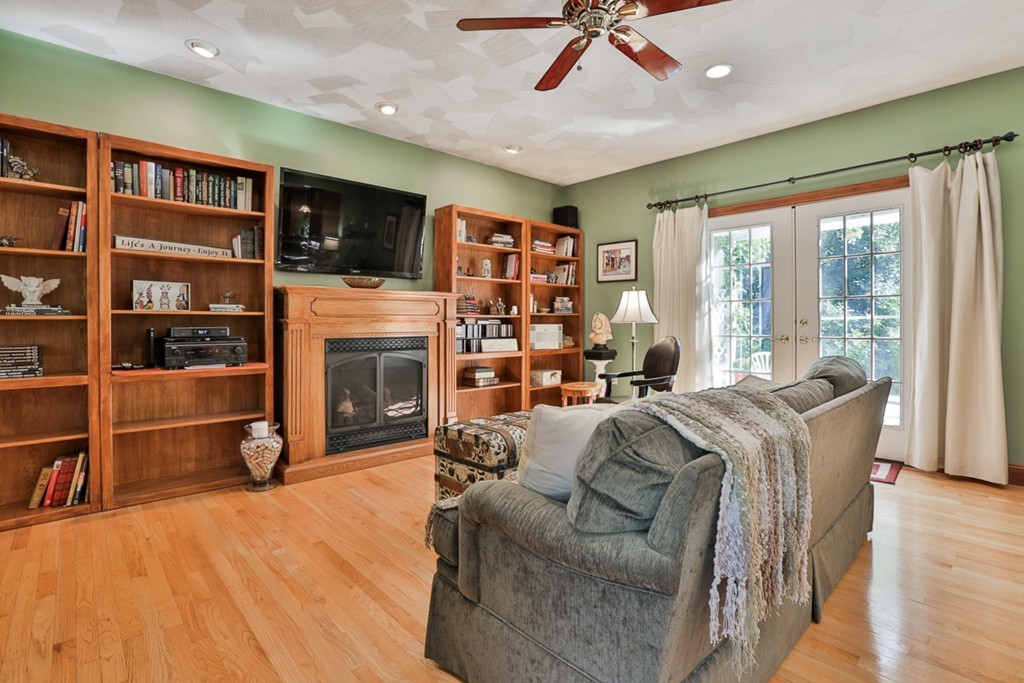 14 Belmont Road Billerica, MA 01821 - Photo 20 of 30 a living room with furniture and a fireplace