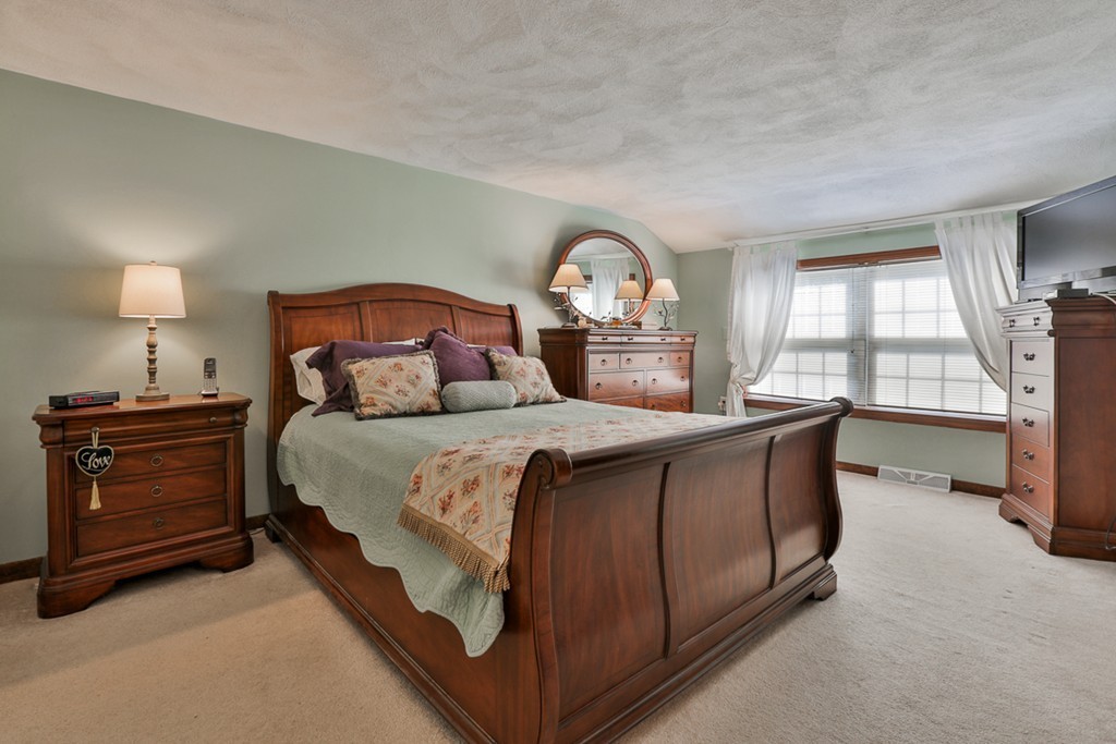 14 Belmont Road Billerica, MA 01821 - Photo 25 of 30 a bedroom with a bed and a window