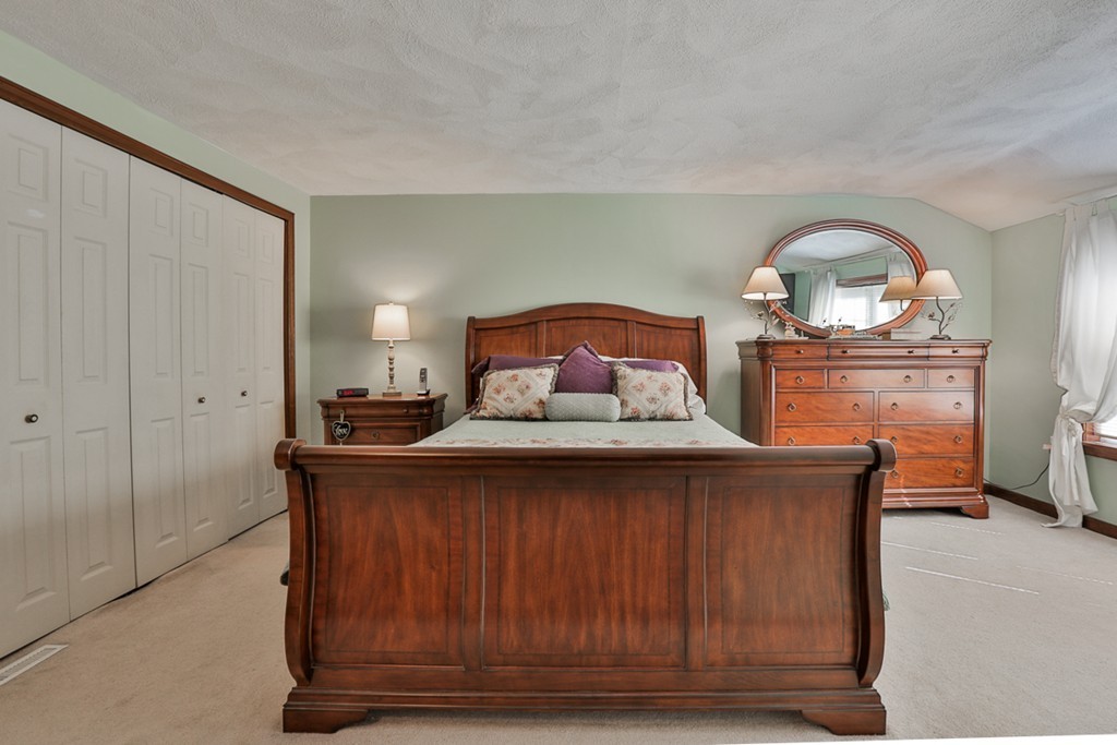 14 Belmont Road Billerica, MA 01821 - Photo 26 of 30 a bedroom with a bed and a dresser