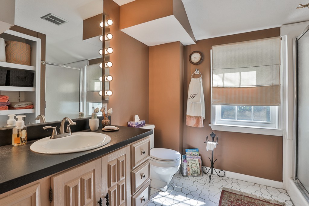 14 Belmont Road Billerica, MA 01821 - Photo 27 of 30 a bathroom with a sink vanity granite and a mirror