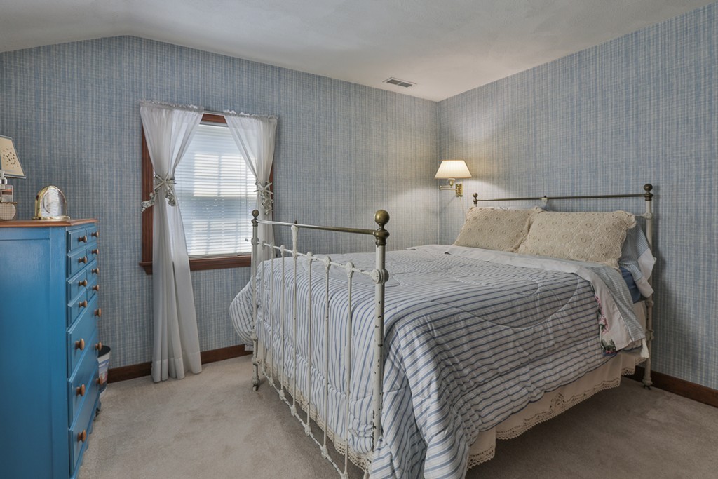 14 Belmont Road Billerica, MA 01821 - Photo 29 of 30 a bedroom with a bed and a mirror