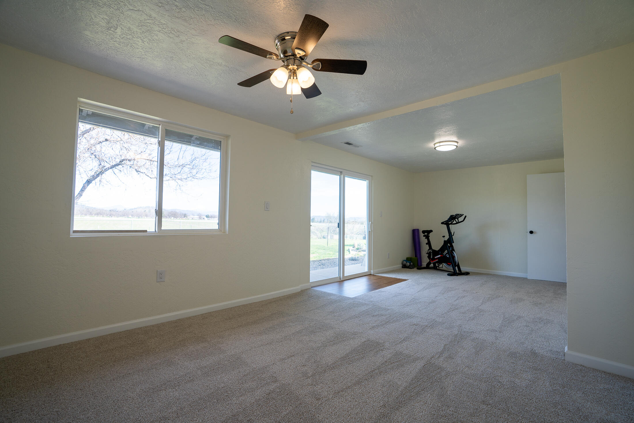 15882 Antioch Road White City, OR 97503 - Photo 27 of 49 a view of an empty room with a window