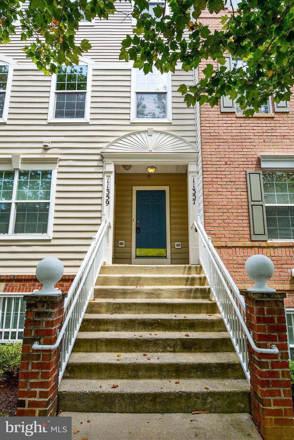 11357 King George Drive, Unit 10 Wheaton, MD 20902 - Photo 1 of 30 a front view of a house with windows and stairs