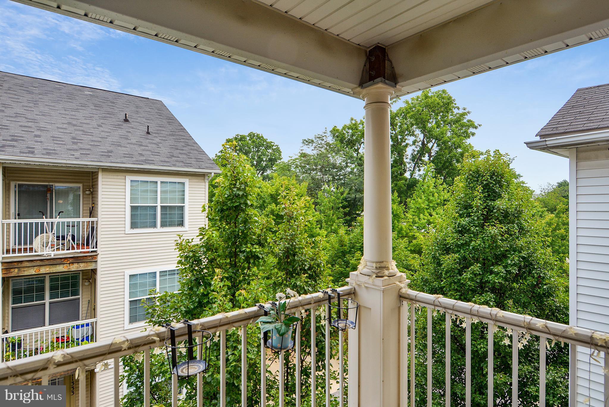 11357 King George Drive, Unit 10 Wheaton, MD 20902 - Photo 13 of 30 a front view of a house with trees