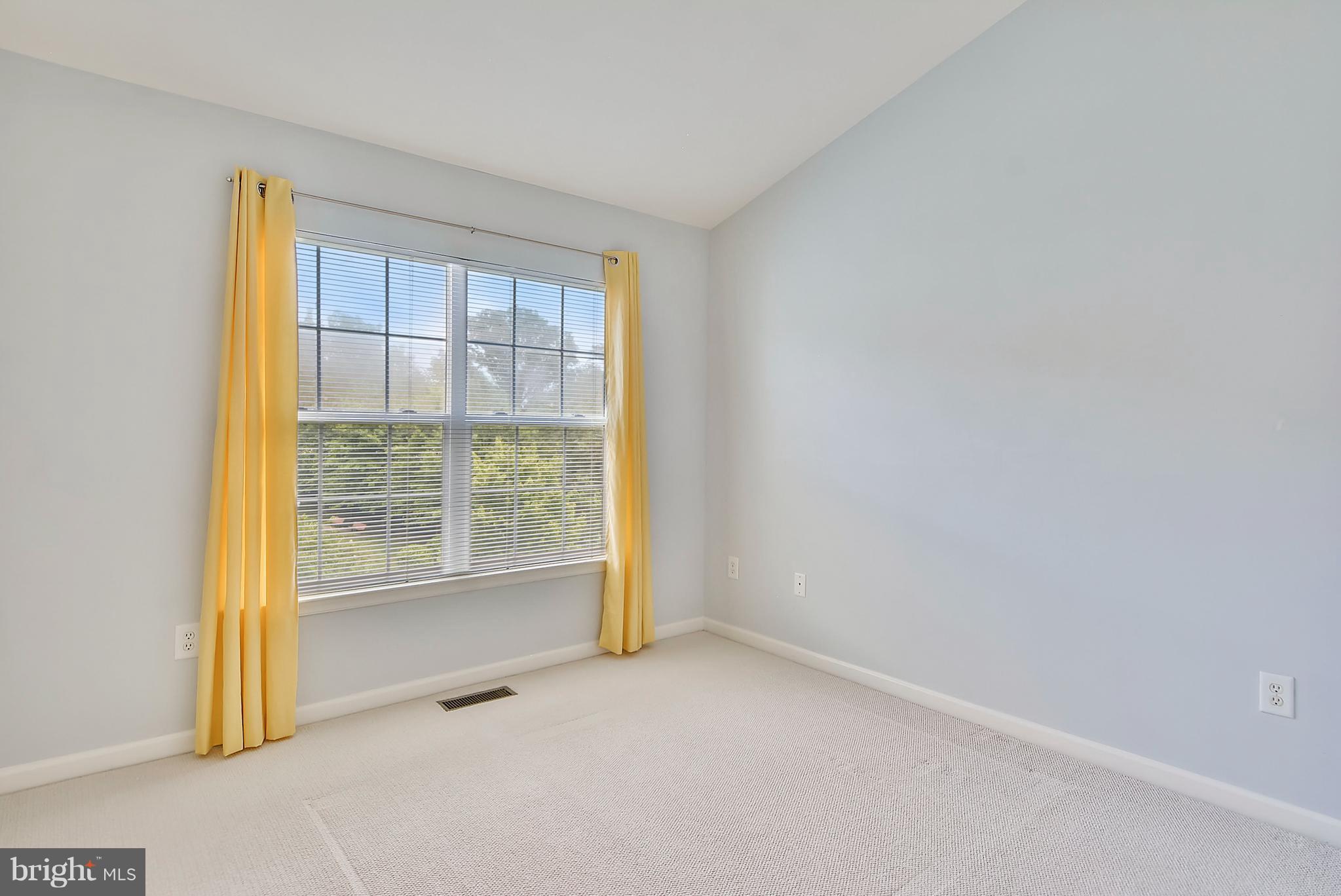 11357 King George Drive, Unit 10 Wheaton, MD 20902 - Photo 14 of 30 a view of an empty room with a window