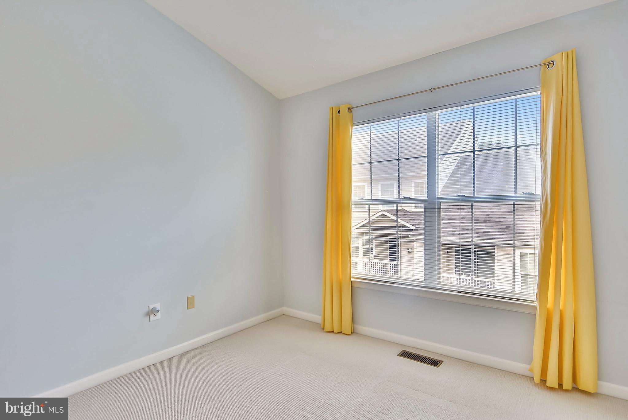 11357 King George Drive, Unit 10 Wheaton, MD 20902 - Photo 15 of 30 a view of an empty room with a window