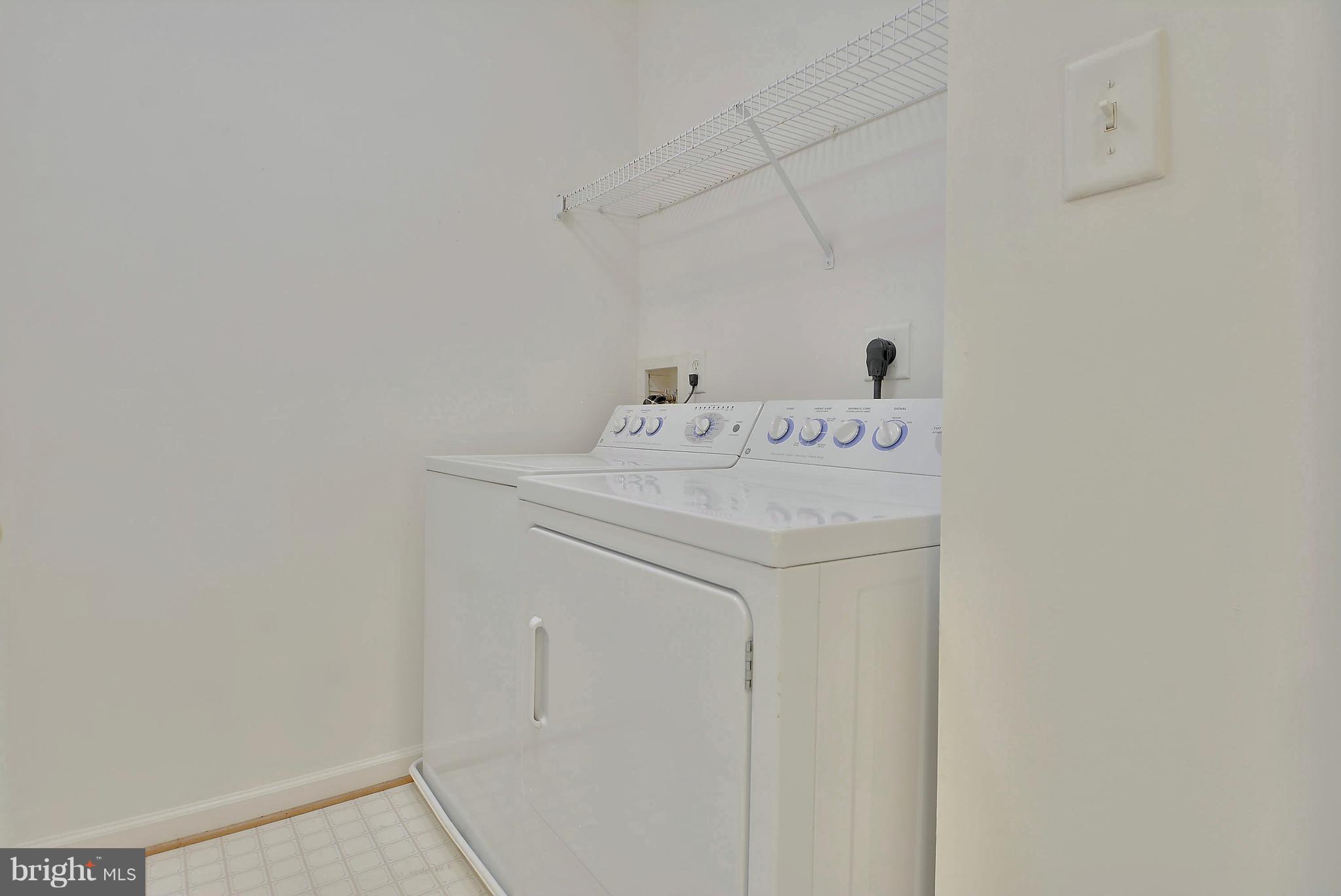 11357 King George Drive, Unit 10 Wheaton, MD 20902 - Photo 22 of 30 a utility room with dryer and washer