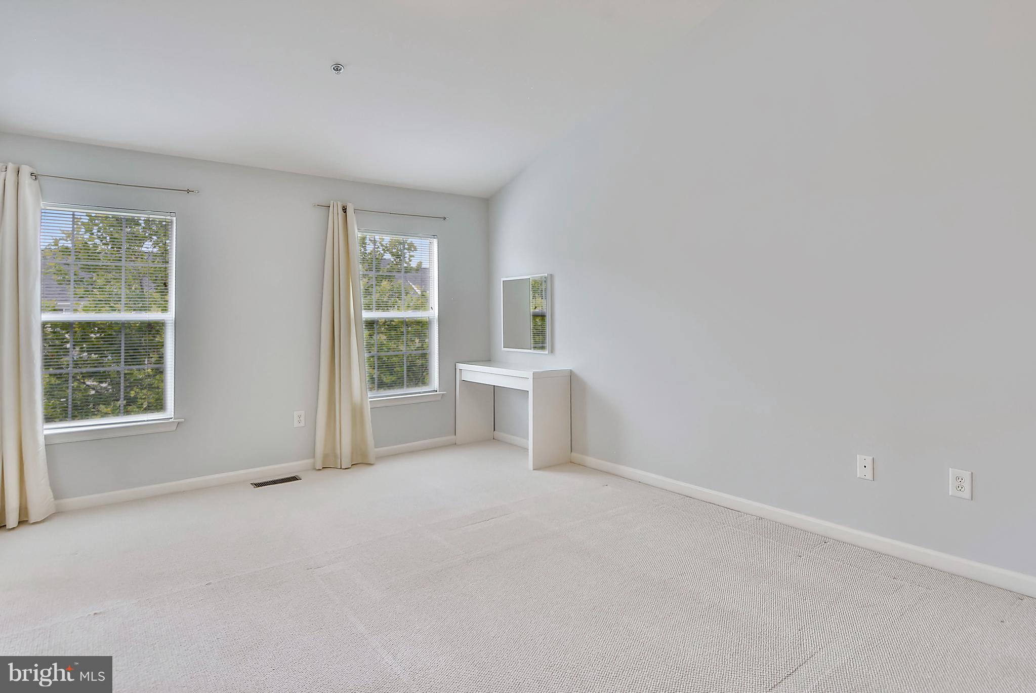 11357 King George Drive, Unit 10 Wheaton, MD 20902 - Photo 23 of 30 a view of an empty room with a window