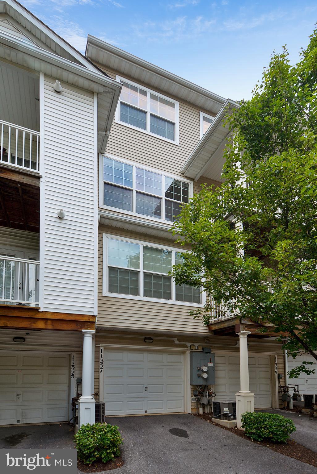 11357 King George Drive, Unit 10 Wheaton, MD 20902 - Photo 29 of 30 a front view of a house with a garage