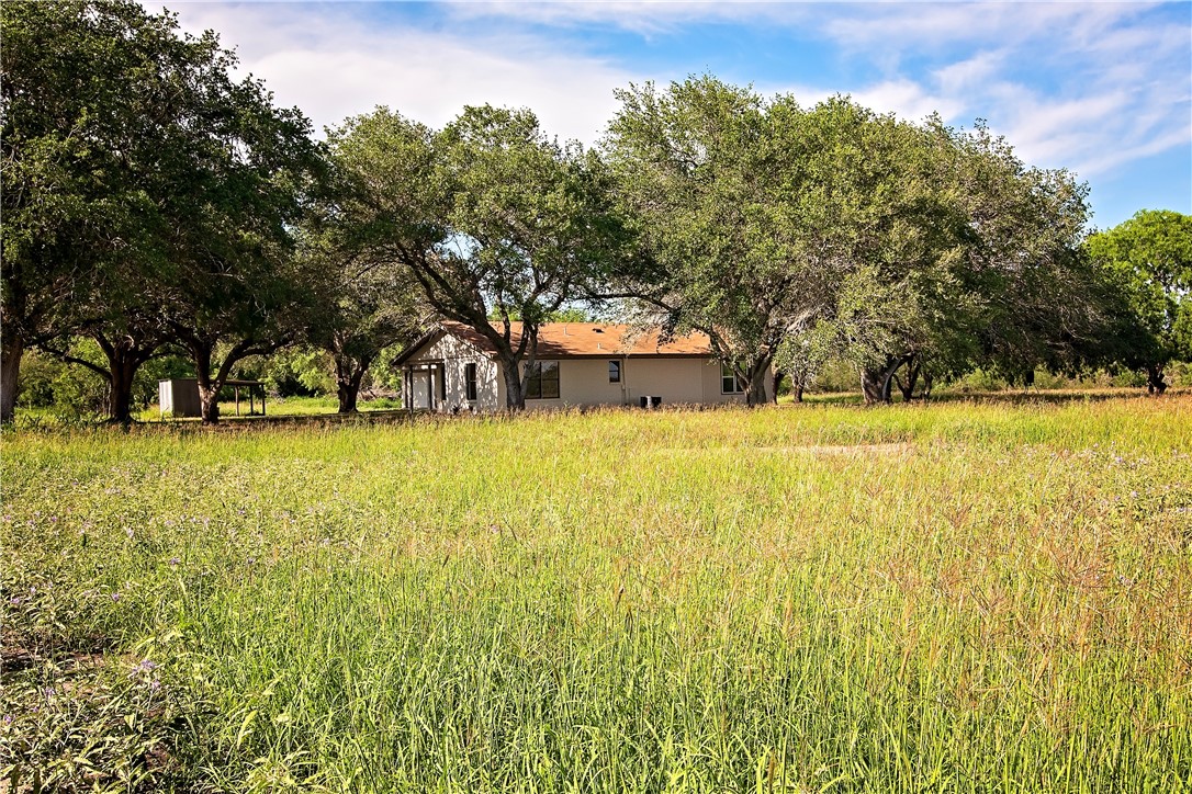202 Ranch Road Mathis, TX 78368 - Photo 34 of 36 a view of a swimming pool with an outdoor space and seating area