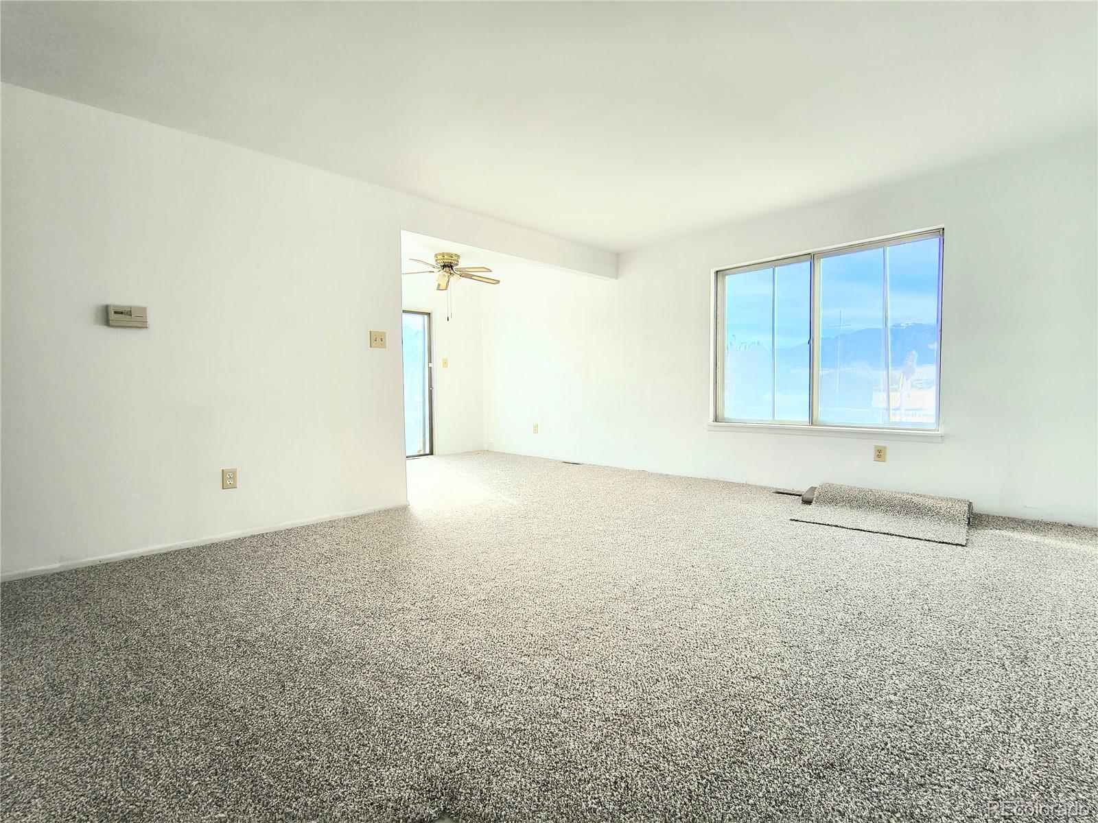 3279 County Rd CC252 Colorado City, CO 81019 - Photo 2 of 22 an empty room with a window