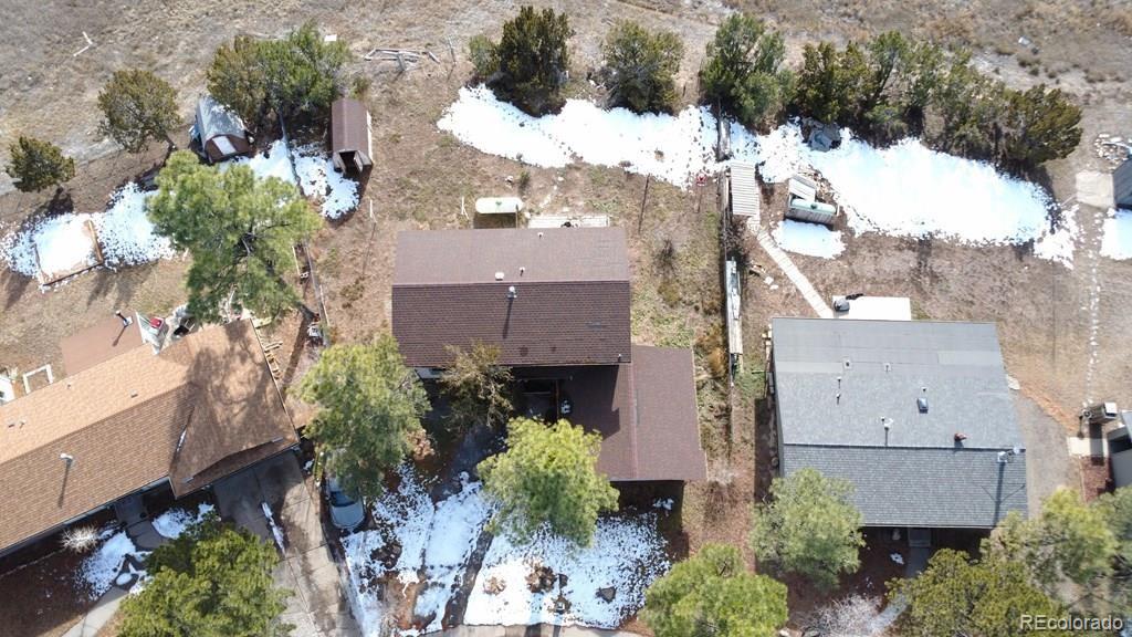 3279 County Rd CC252 Colorado City, CO 81019 - Photo 21 of 22 an aerial view of a house with a yard and covered with snow