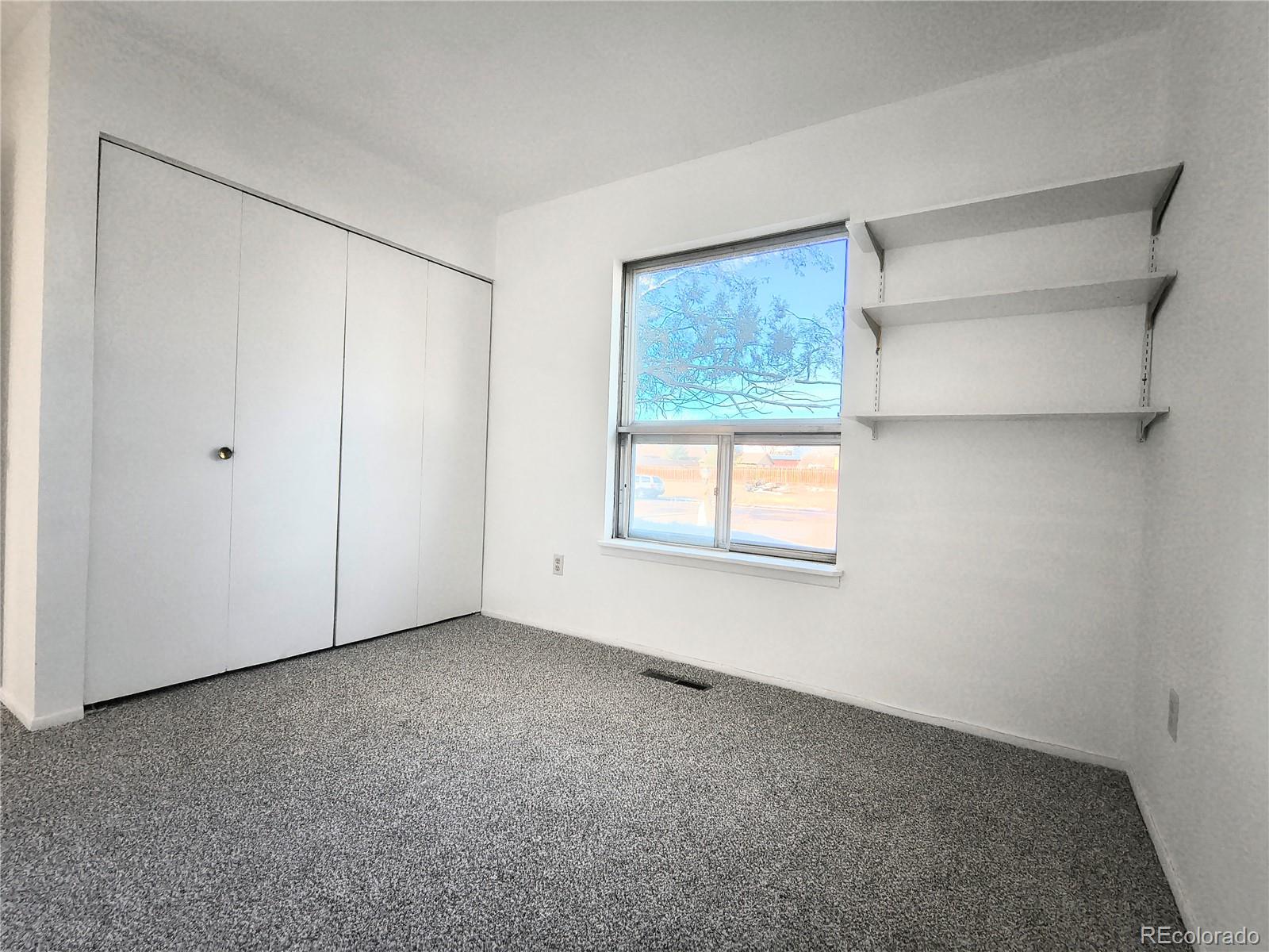 3279 County Rd CC252 Colorado City, CO 81019 - Photo 7 of 22 a view of an empty room with a window
