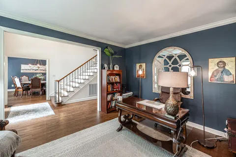 a view of a dining room with furniture window and wooden floor