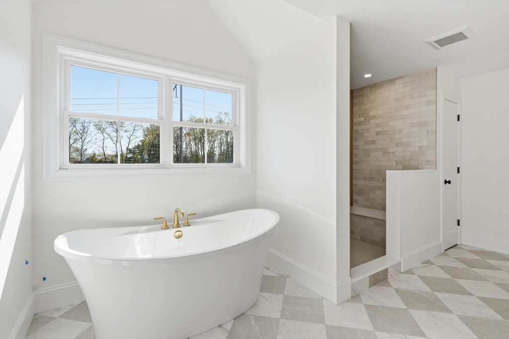 16 Couture Way Middleton, MA 01949 - Photo 23 of 36 a bathroom with a bathtub and a window