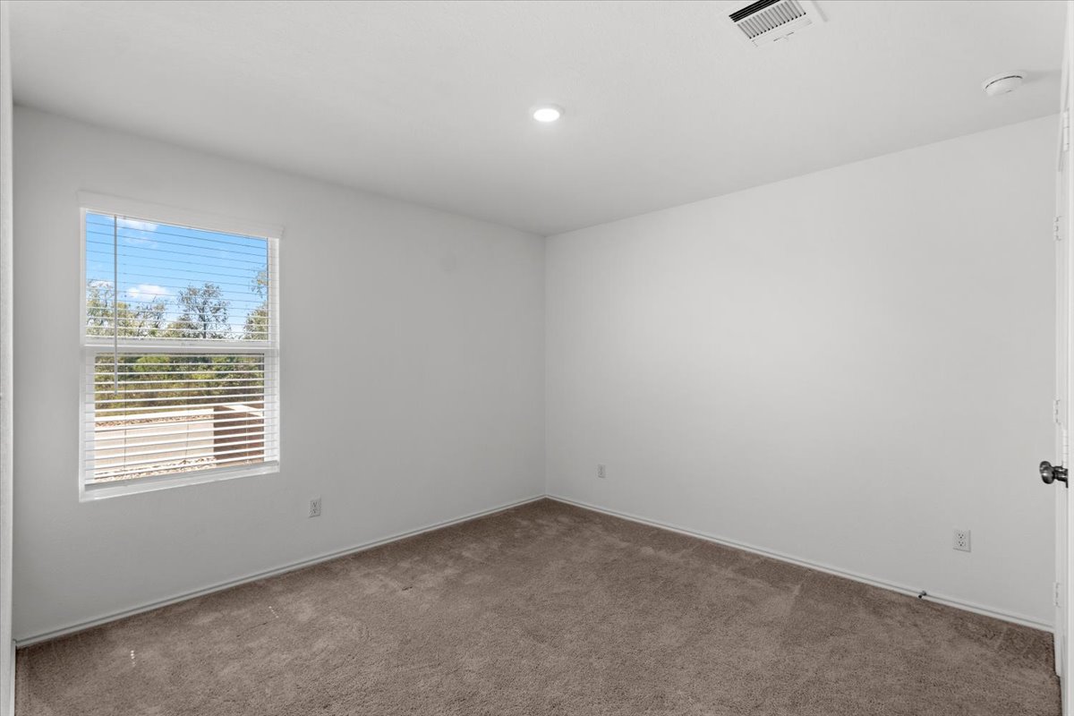 167 Jeffers Kyle, TX 78640 - Photo 14 of 40 an empty room with a window