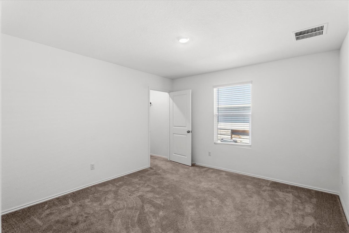 167 Jeffers Kyle, TX 78640 - Photo 17 of 40 a view of an empty room with a window