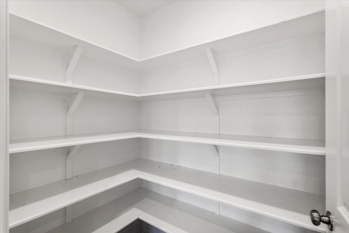 167 Jeffers Kyle, TX 78640 - Photo 9 of 40 a view of walk in closet with empty racks