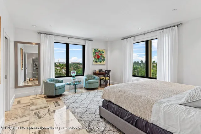 a bedroom with a bed lamp and window